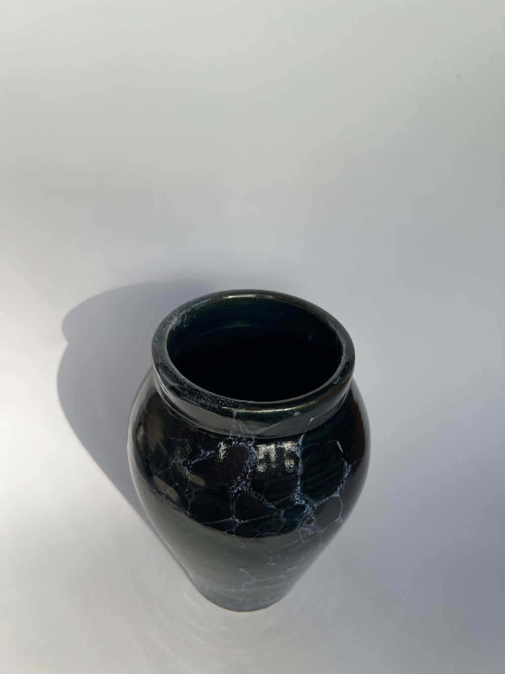 Deep blue vase with white bubbles