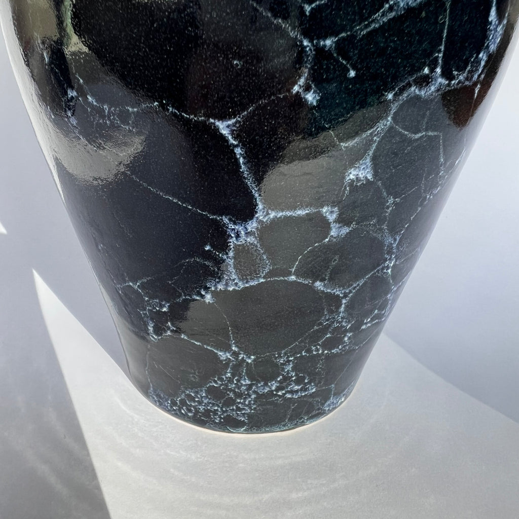 Deep blue vase with white bubbles