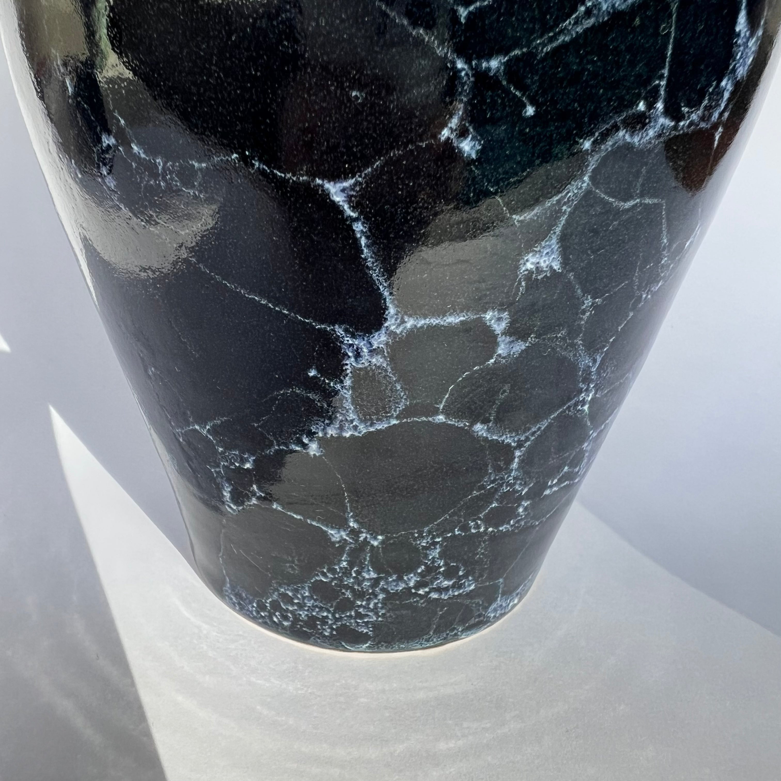 Deep blue vase with white bubbles