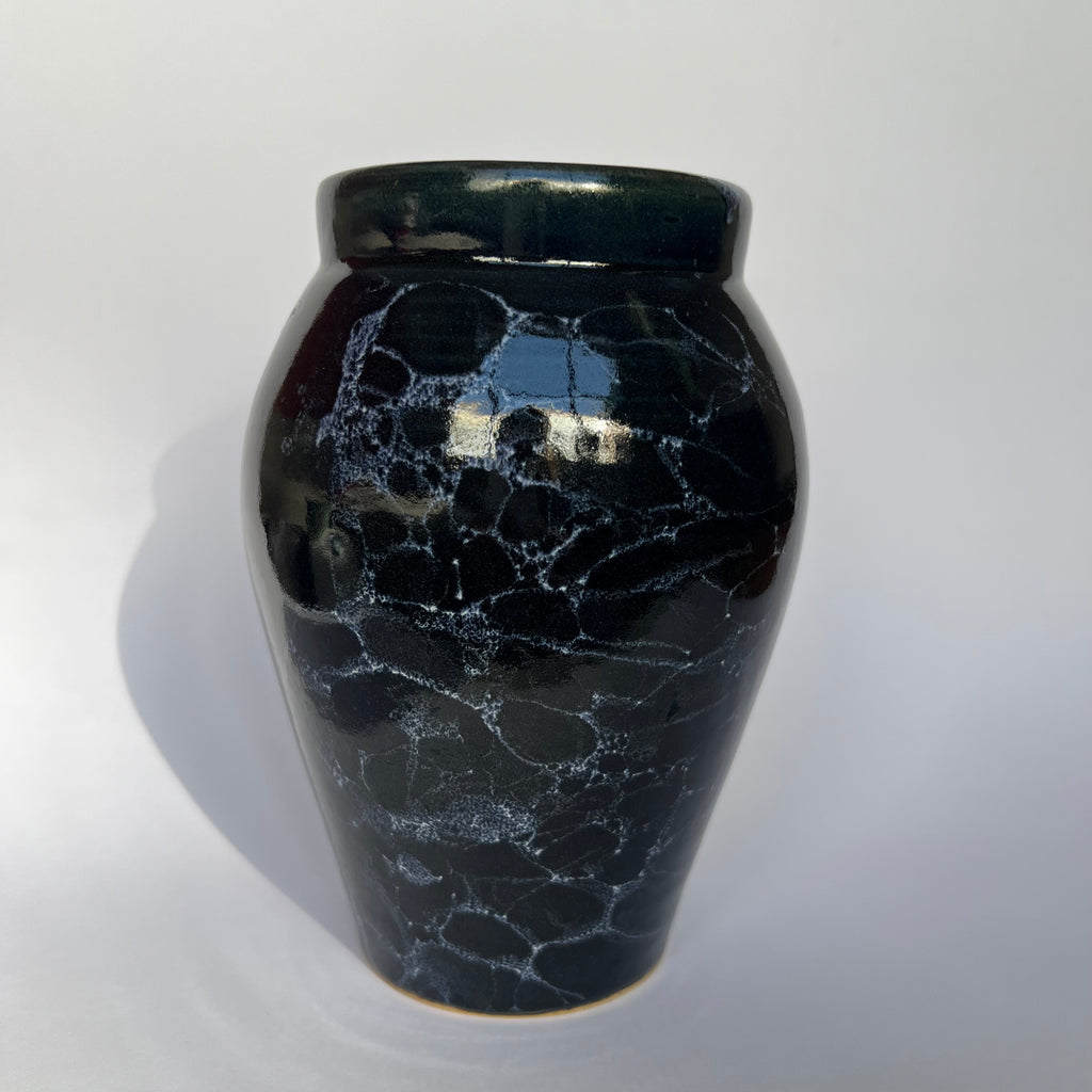 Deep blue vase with white bubbles