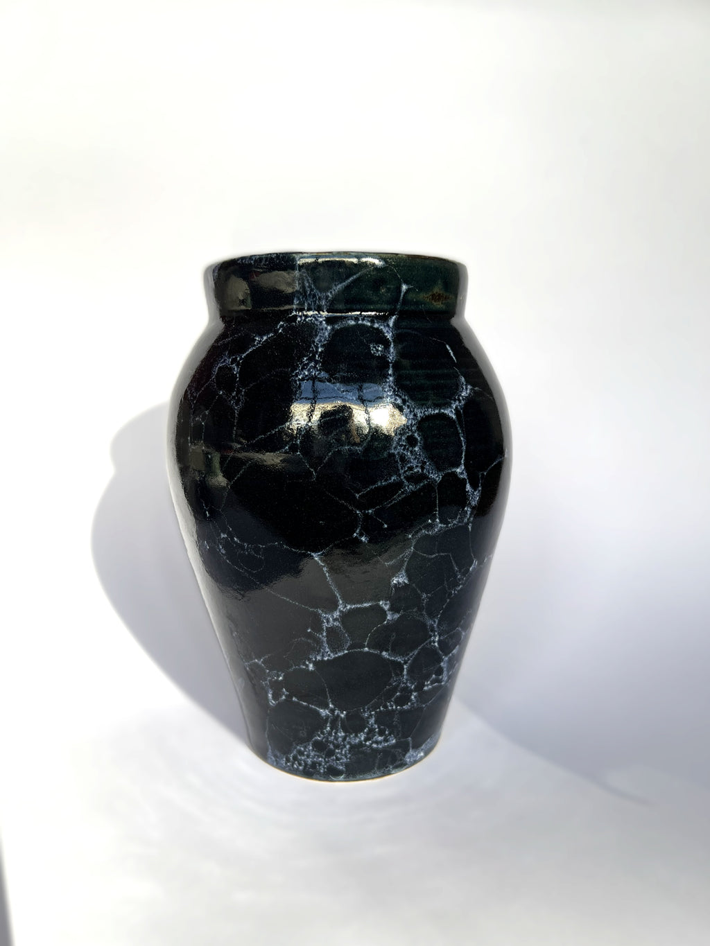 Deep blue vase with white bubbles