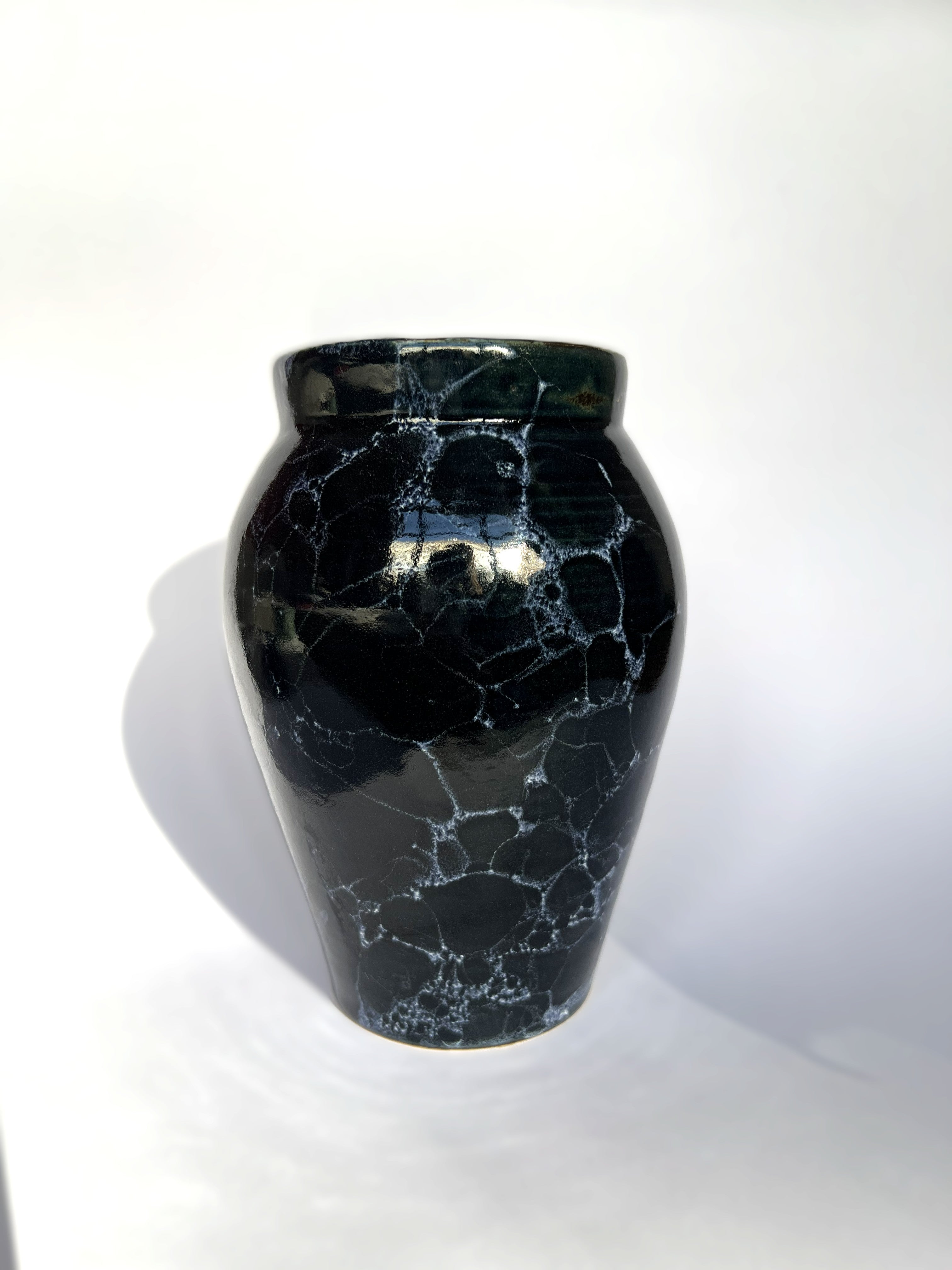 Deep blue vase with white bubbles
